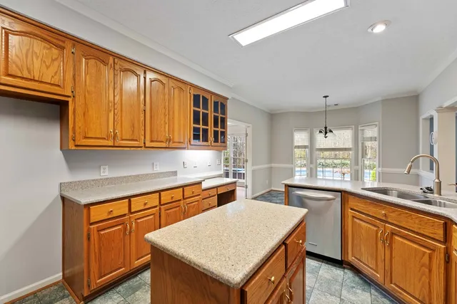 a kitchen with a sink stove and microwave