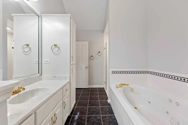 a bathroom with a bathtub and a sink