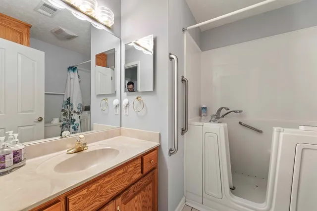 a bathroom with a sink and a mirror