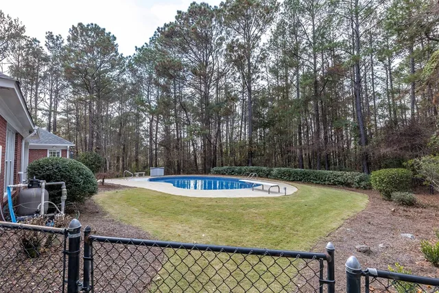 a view of a swimming pool with a patio