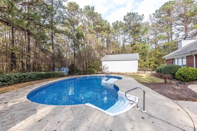 a view of a swimming pool with a patio