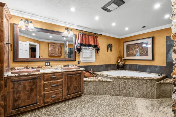 a bathroom with a sink a large mirror and a shower