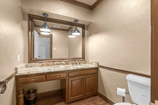a bathroom with a sink a vanity and a mirror