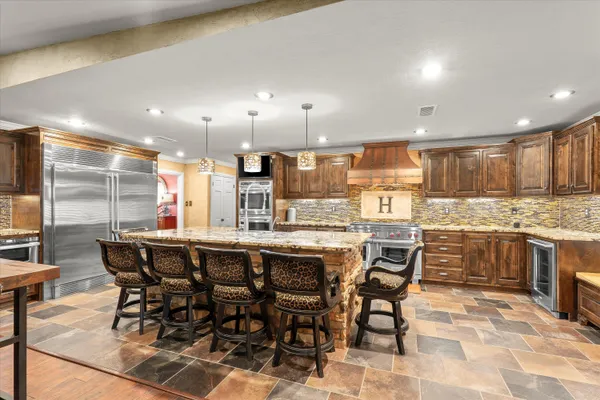 a kitchen with a table and chairs in it