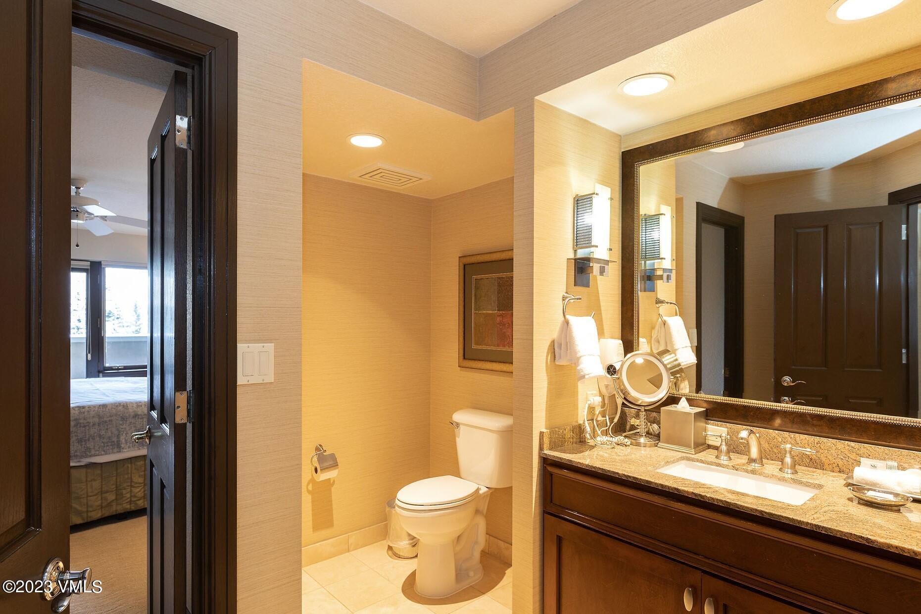 210 Offerson Road, Unit R214 WEEK 36 Beaver Creek, CO 81620 - Photo 11 of 19 a bathroom with a granite countertop sink toilet and shower