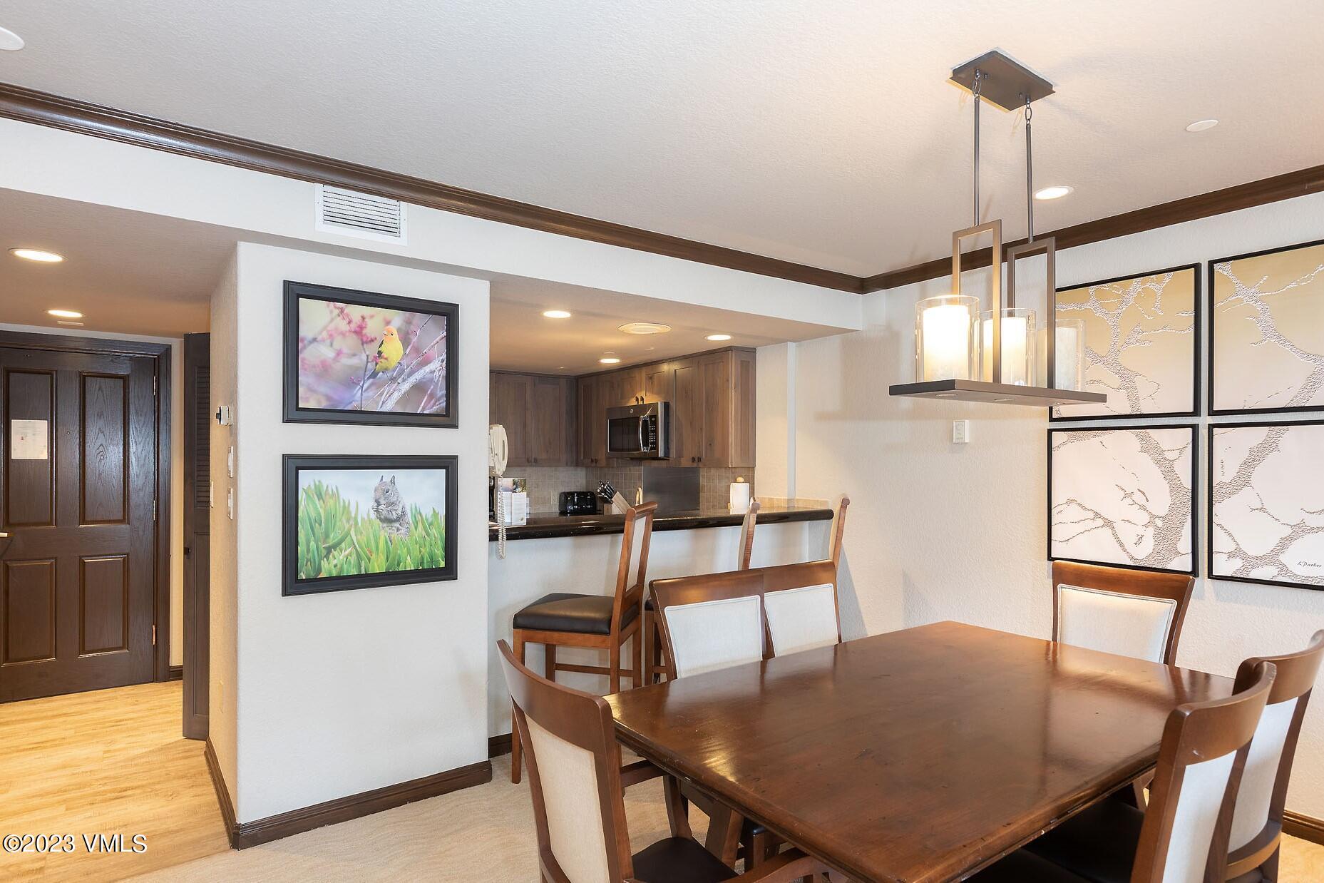 210 Offerson Road, Unit R214 WEEK 36 Beaver Creek, CO 81620 - Photo 4 of 19 a view of a dining room with furniture window and wooden floor