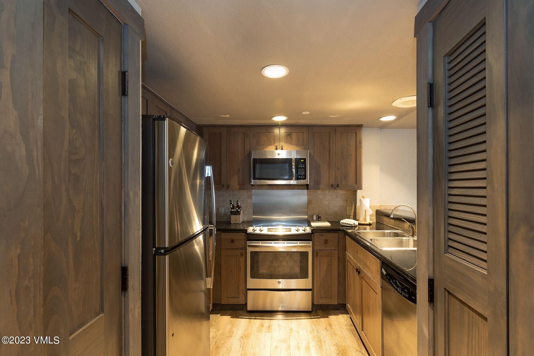 210 Offerson Road, Unit R214 WEEK 36 Beaver Creek, CO 81620 - Photo 5 of 19 a kitchen with a sink and stainless steel appliances