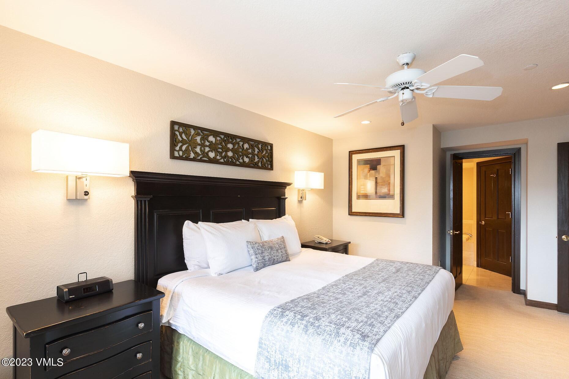 210 Offerson Road, Unit R214 WEEK 36 Beaver Creek, CO 81620 - Photo 7 of 19 a bedroom with a bed and a night stand