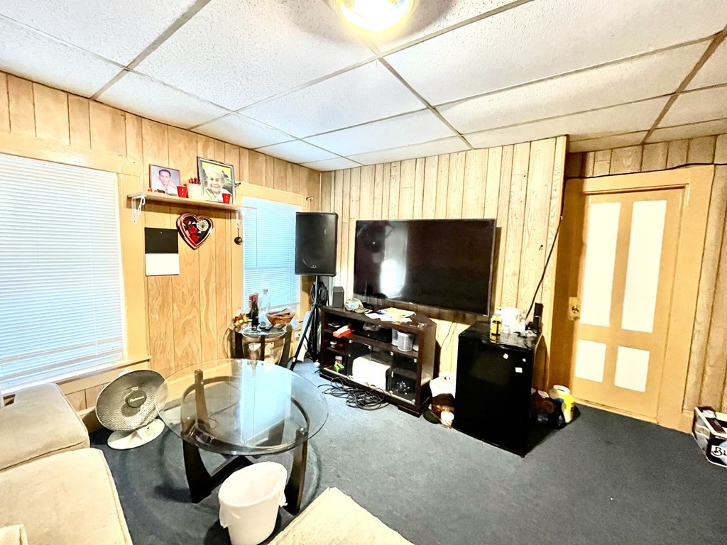 68 Smith Street Lowell, MA 01851 - Photo 5 of 24 a living room with furniture and a flat screen tv