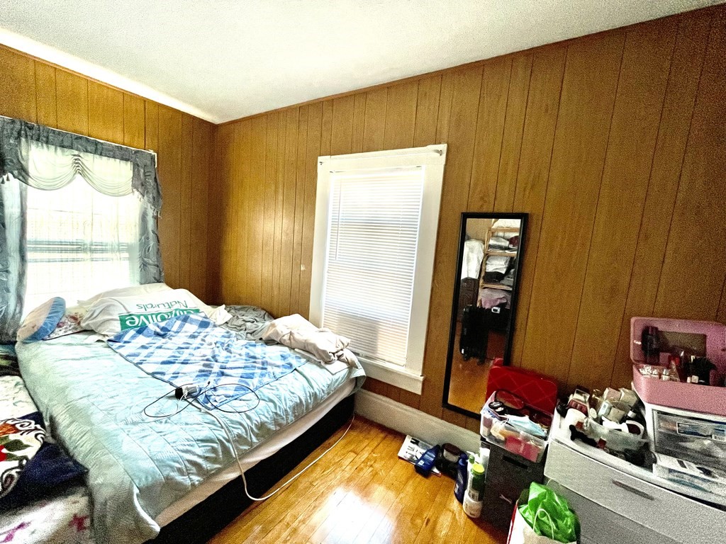 68 Smith Street Lowell, MA 01851 - Photo 9 of 24 a bedroom with bed and window