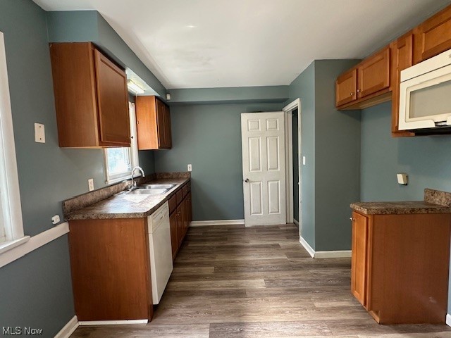 4230 Bluestone Road South Euclid, OH 44121 - Photo 2 of 35 Kitchen with white appliances, dark hardwood flooring, and sink