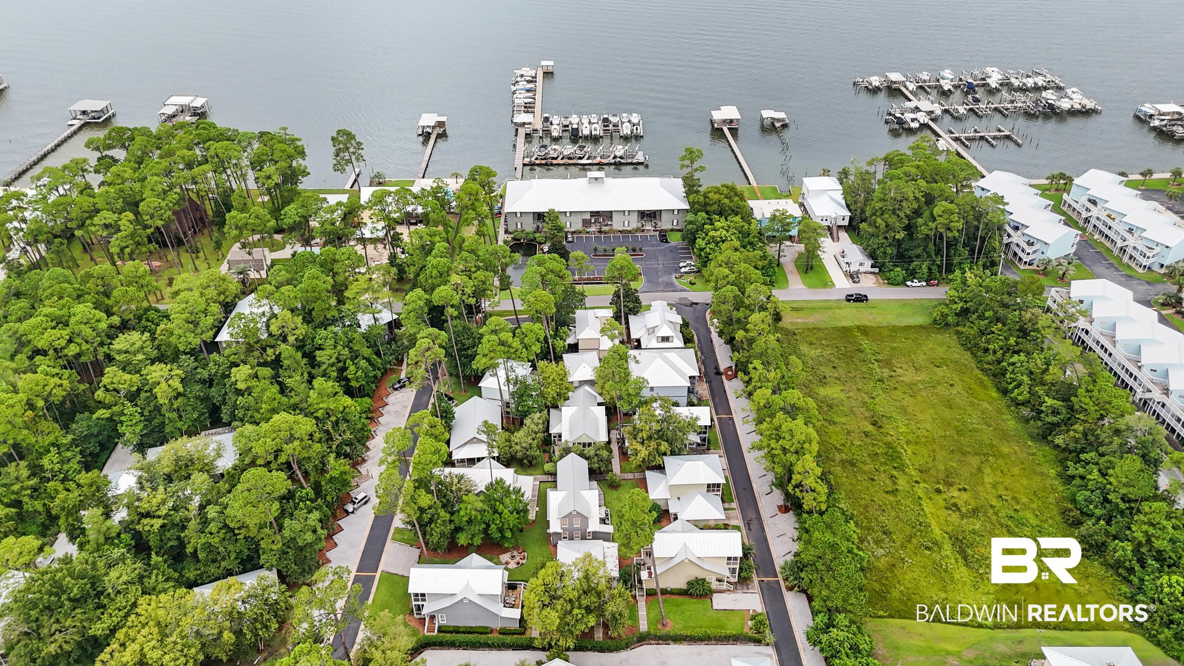 25773 Canal Road, Unit 18 Orange Beach, AL 36561 - Photo 31 of 44 Drone / aerial view of numerous boat docks and a large body of water