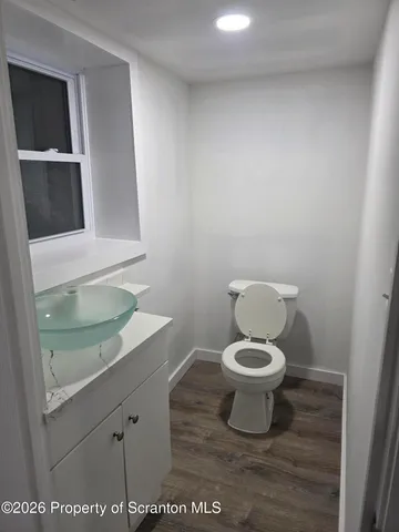 a bathroom with a toilet and a sink