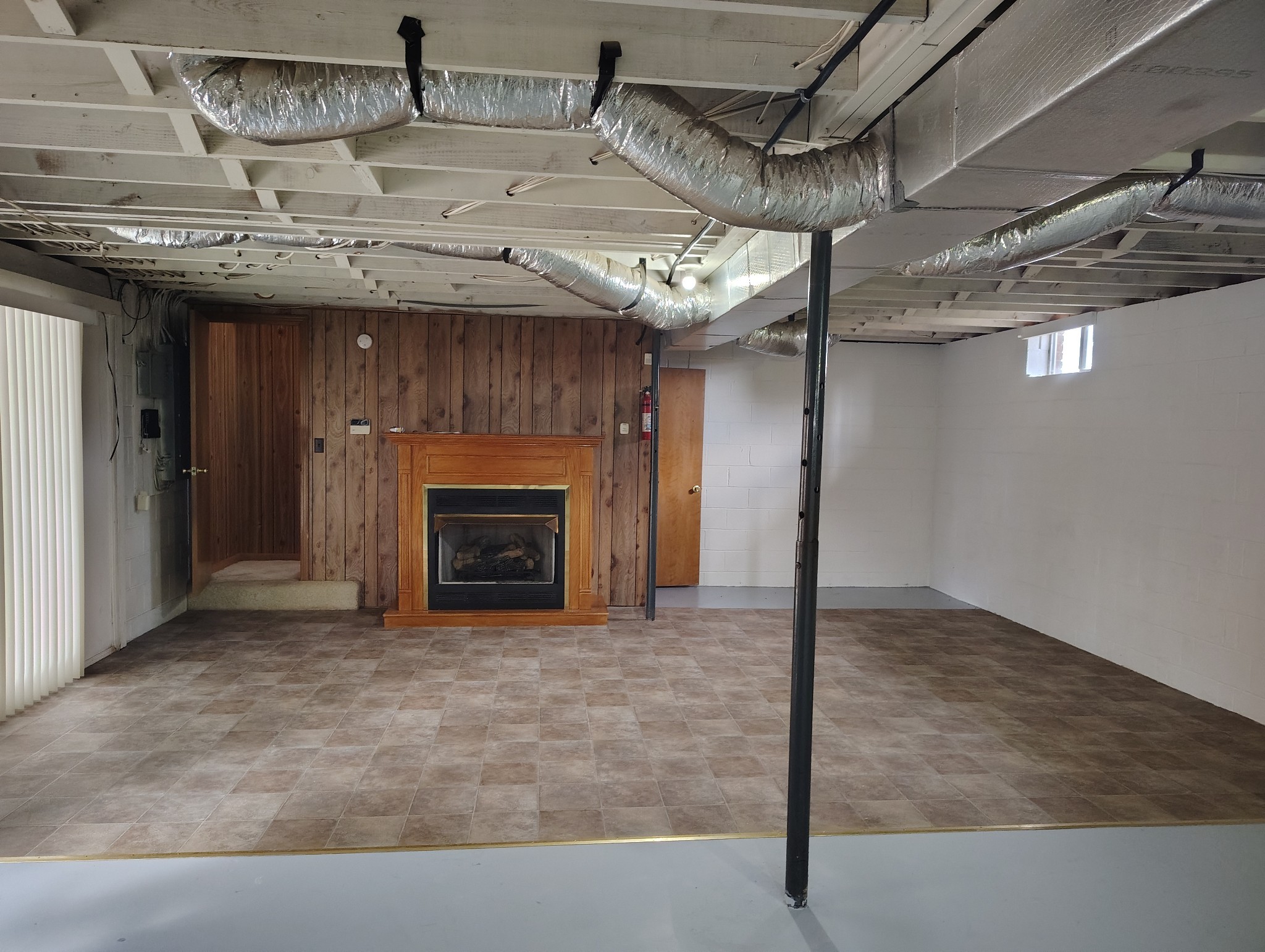 5279 Oak Grove Road Red Boiling Springs, TN 37150 - Photo 19 of 23 a view of an empty room with a fireplace
