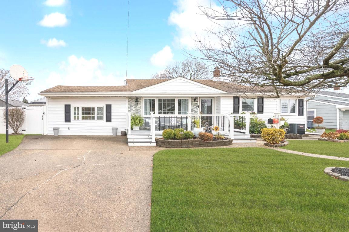 a front view of a house with swimming pool having outdoor seating