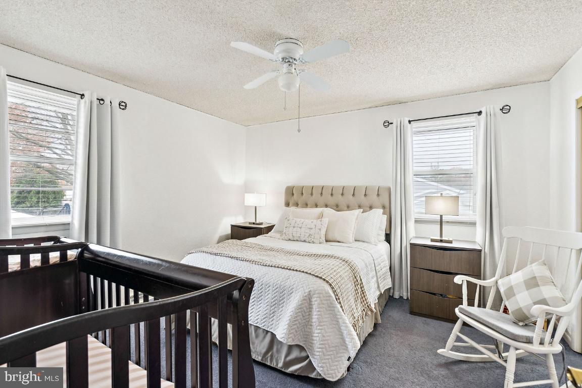 13 Belmont Road Bellmawr, NJ 08031 - Photo 15 of 32 a bedroom with a bed and a window