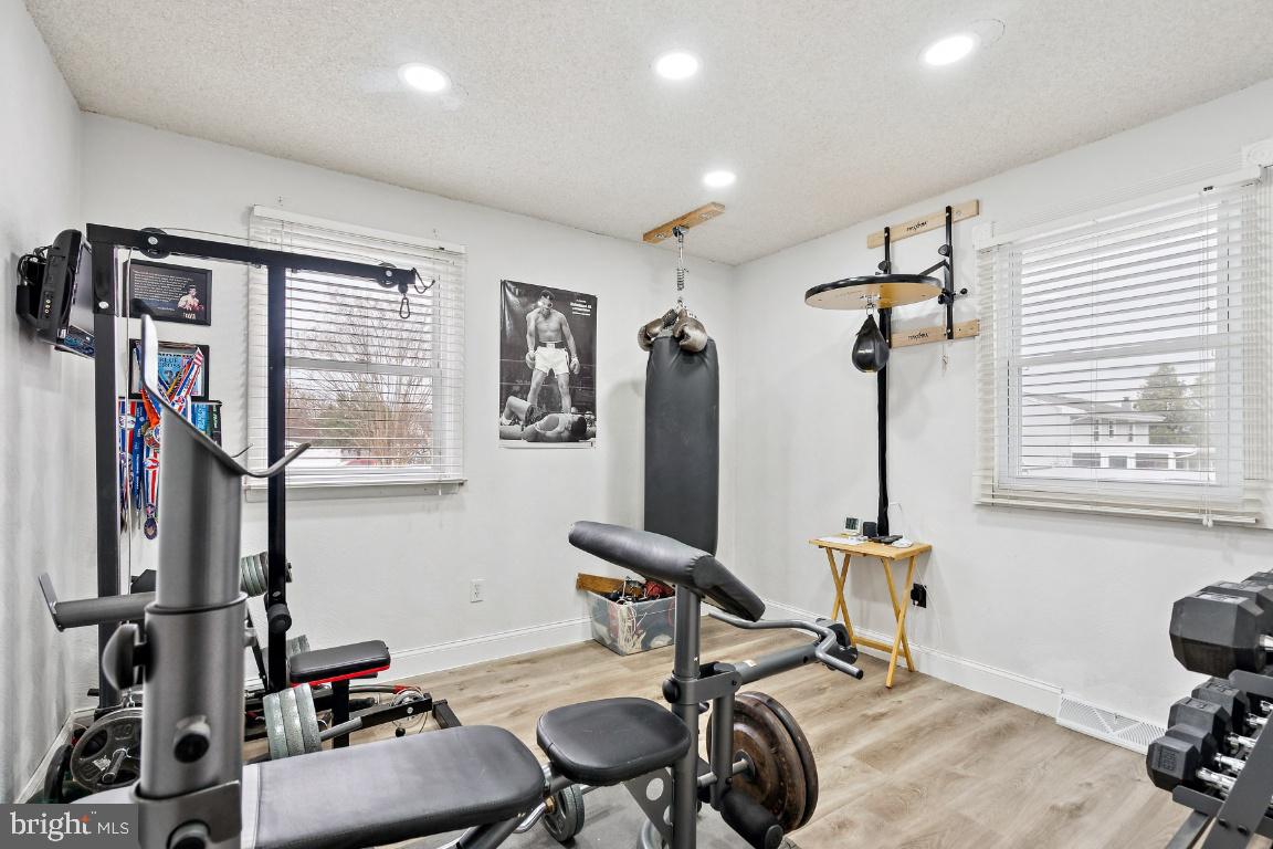 13 Belmont Road Bellmawr, NJ 08031 - Photo 16 of 32 a view of a room with gym equipment