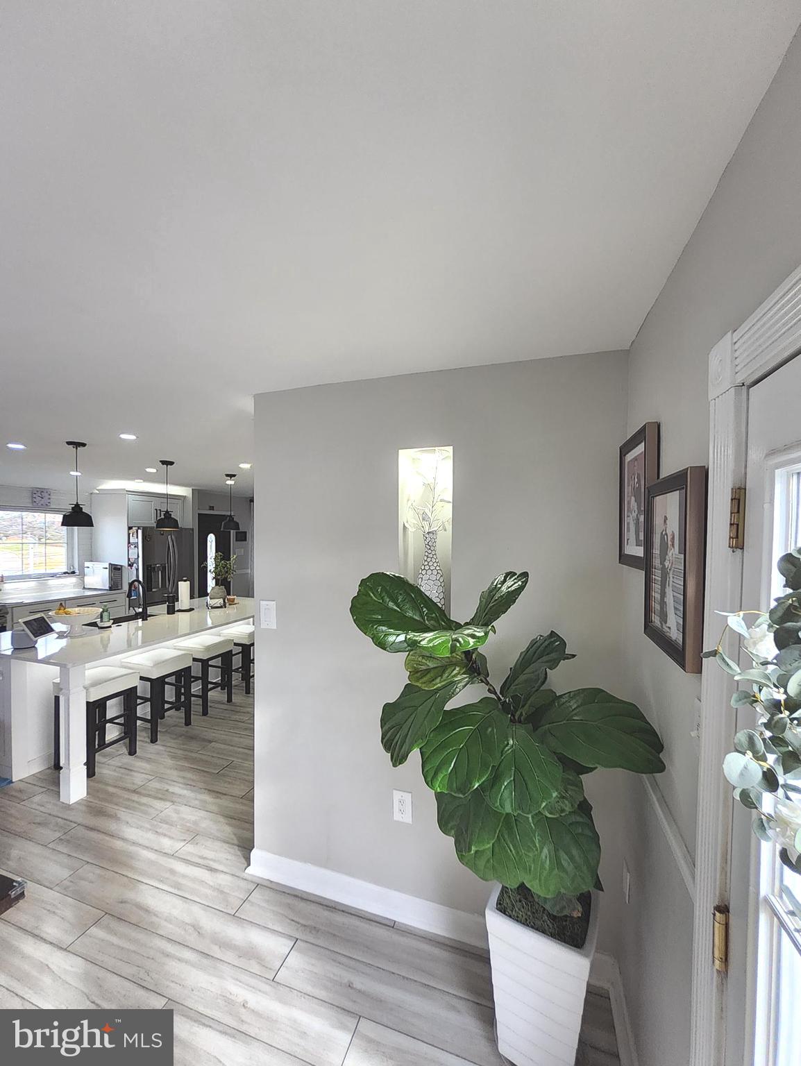 13 Belmont Road Bellmawr, NJ 08031 - Photo 24 of 32 a dining room with furniture potted plants and wooden floor