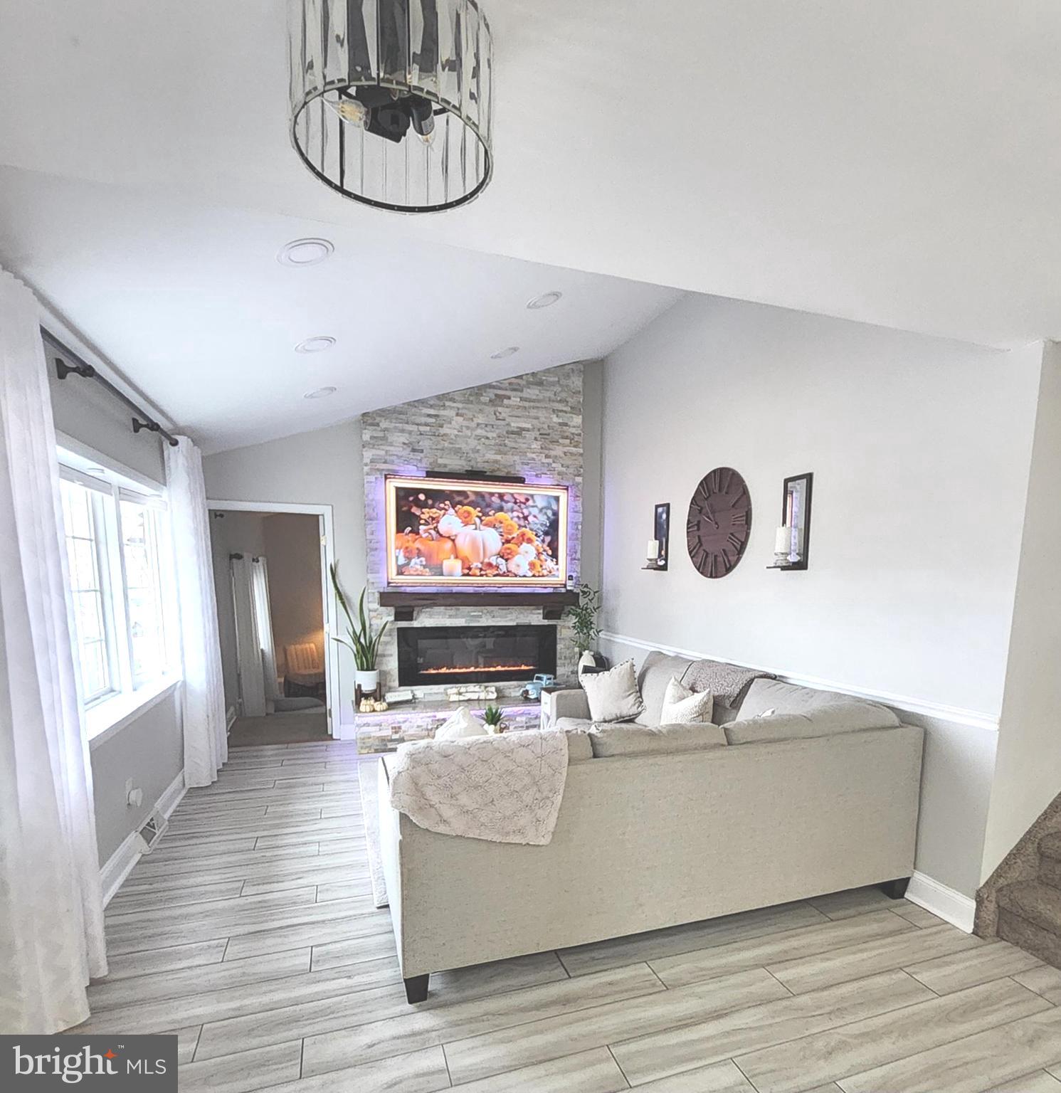 13 Belmont Road Bellmawr, NJ 08031 - Photo 25 of 32 a living room with furniture and a flat screen tv