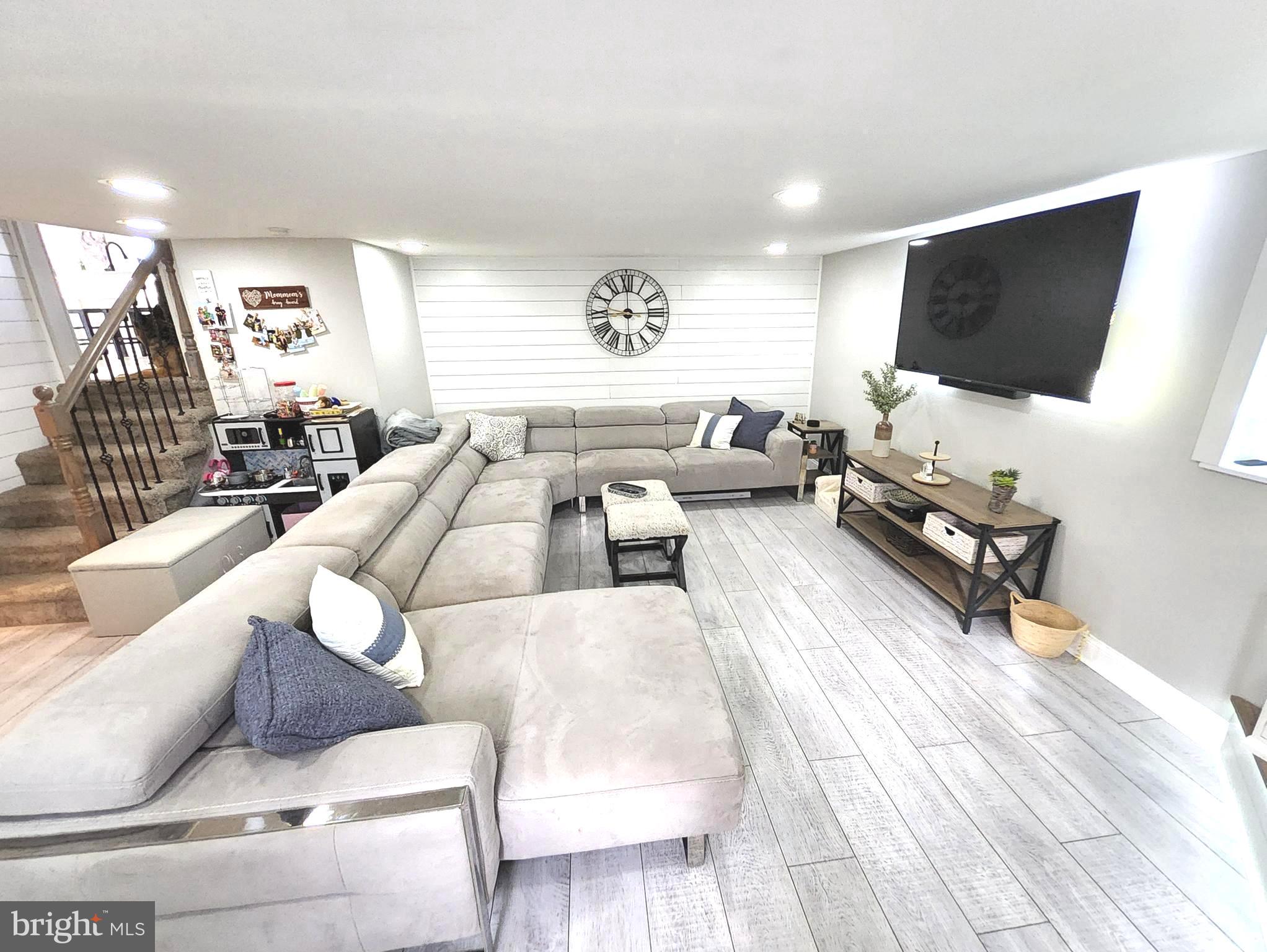 13 Belmont Road Bellmawr, NJ 08031 - Photo 29 of 32 a living room with furniture and a flat screen tv