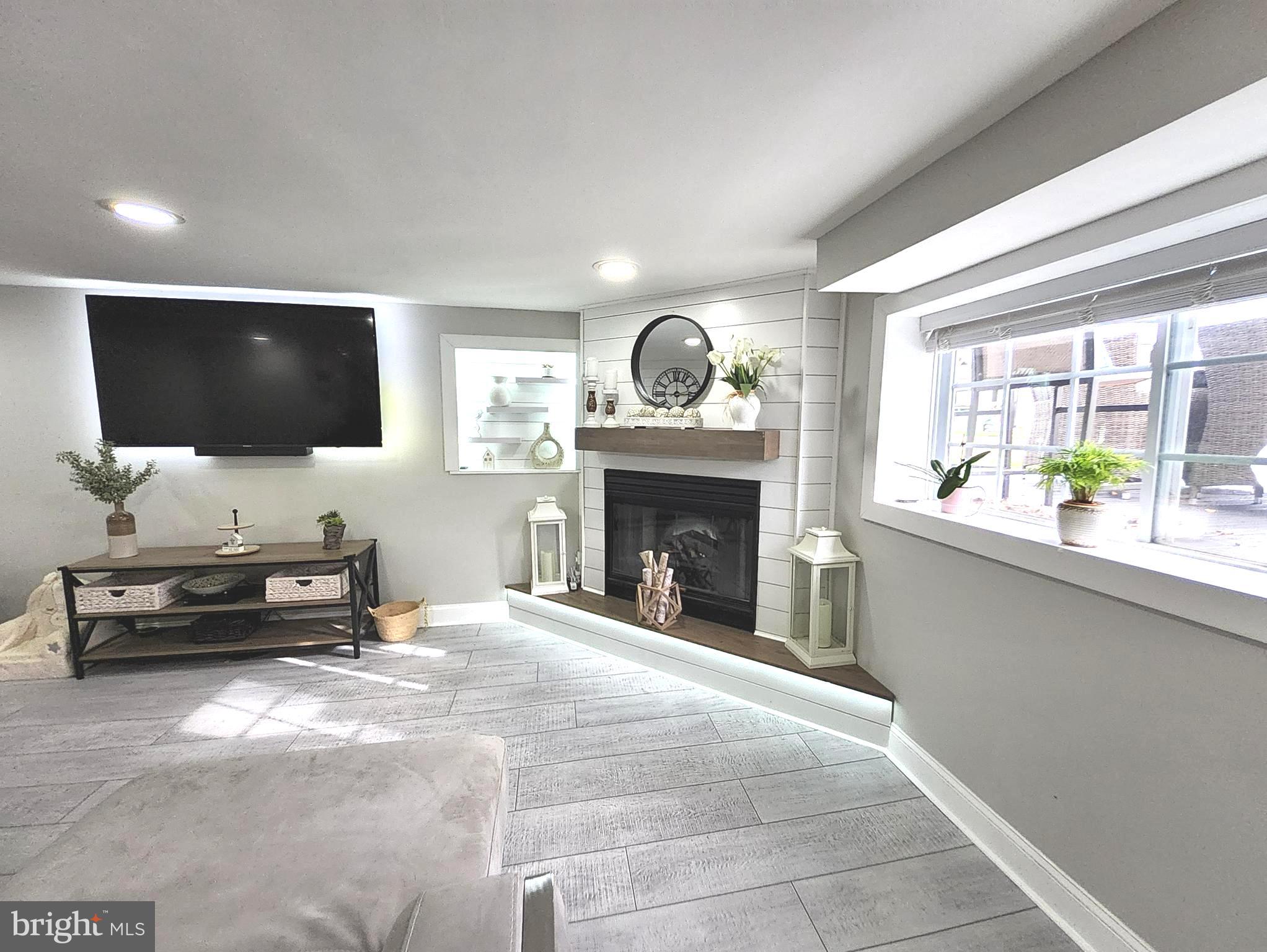 13 Belmont Road Bellmawr, NJ 08031 - Photo 30 of 32 a living room with furniture and a flat screen tv
