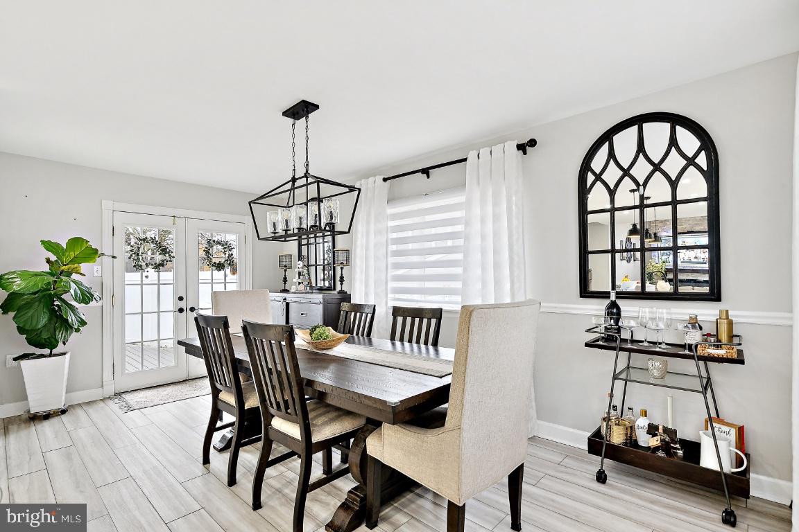 13 Belmont Road Bellmawr, NJ 08031 - Photo 4 of 32 a view of a dining room with furniture window and wooden floor