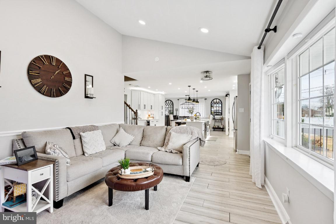 13 Belmont Road Bellmawr, NJ 08031 - Photo 5 of 32 a living room with furniture a rug and a large window