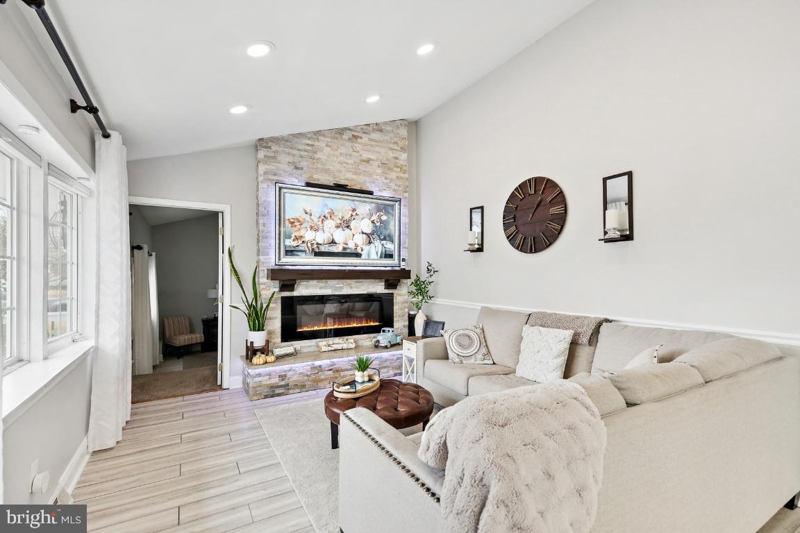 13 Belmont Road Bellmawr, NJ 08031 - Photo 6 of 32 a living room with furniture and a flat screen tv