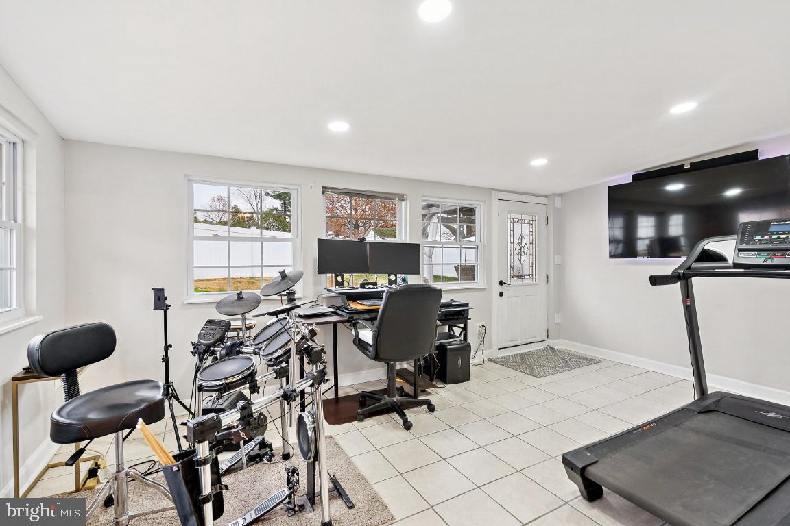 13 Belmont Road Bellmawr, NJ 08031 - Photo 9 of 32 a view of a workspace with furniture and a potted plant