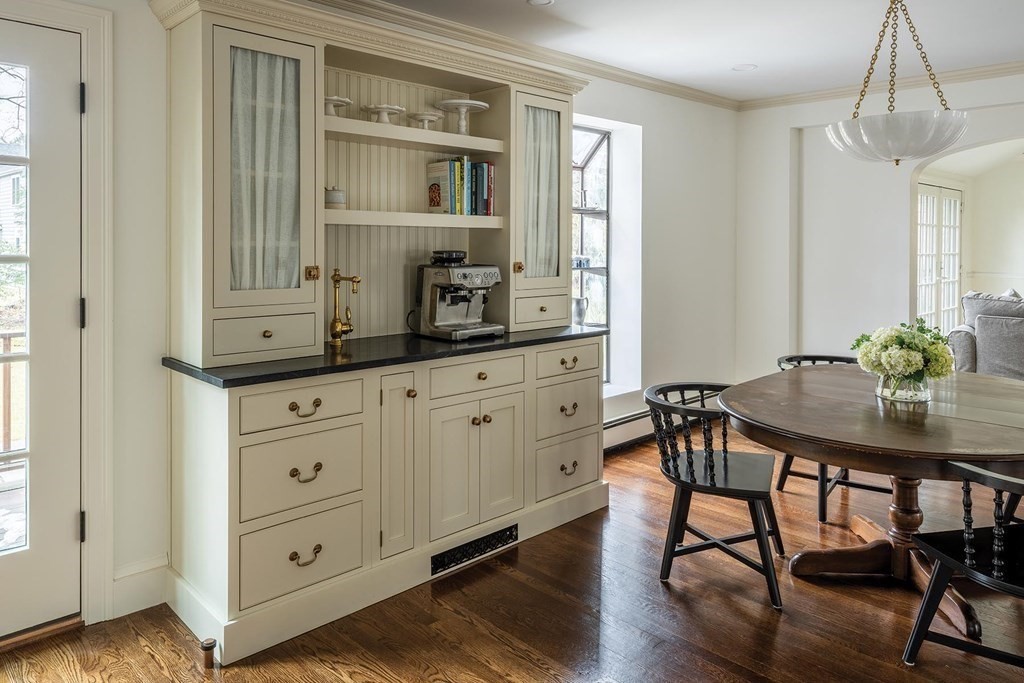 92 Gordon Road Newton, MA 02468 - Photo 6 of 16 a kitchen with a table chairs and cabinets