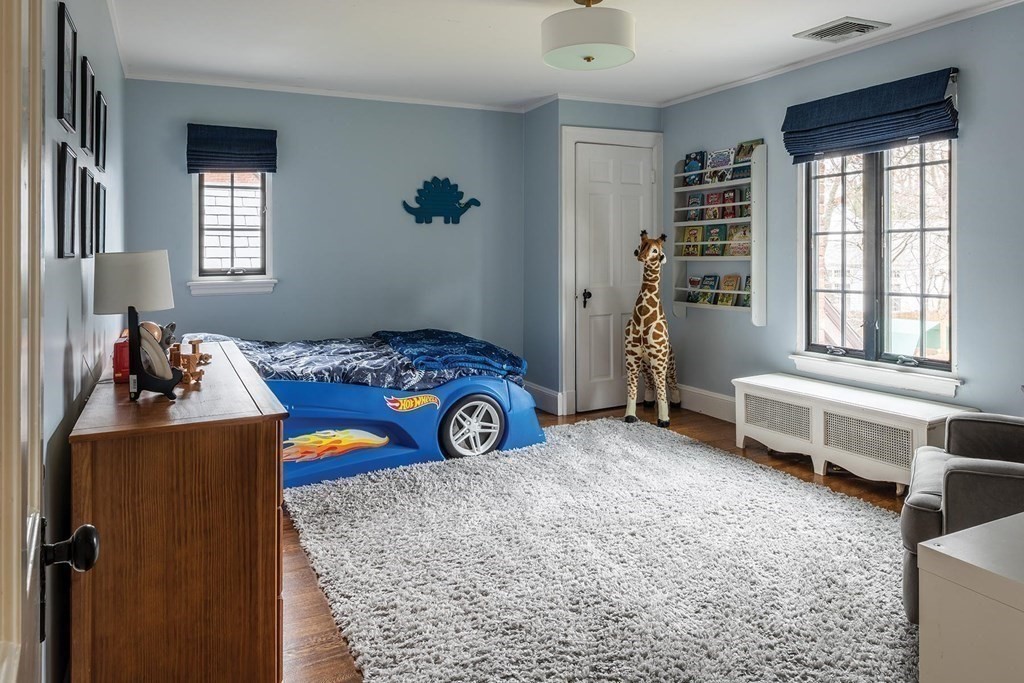 92 Gordon Road Newton, MA 02468 - Photo 10 of 16 a bedroom with a bed and a window