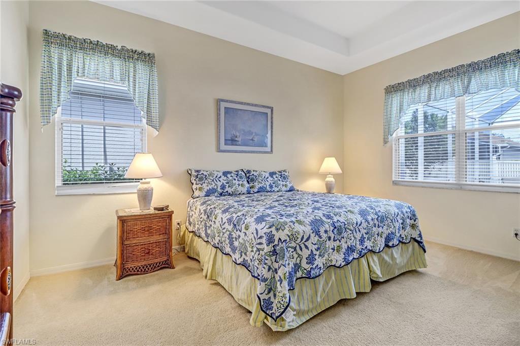 76 Glen Eagle Circle Naples, FL 34104 - Photo 14 of 23 a bedroom with a bed next to a window with outer view