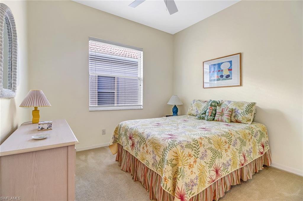 76 Glen Eagle Circle Naples, FL 34104 - Photo 15 of 23 a bedroom with a bed and a window