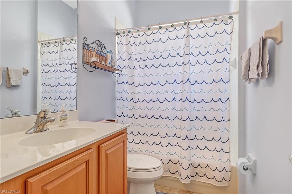 76 Glen Eagle Circle Naples, FL 34104 - Photo 17 of 23 a bathroom with a sink toilet and shower