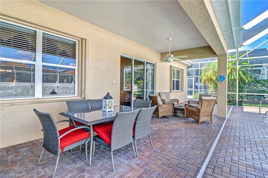 76 Glen Eagle Circle Naples, FL 34104 - Photo 20 of 23 a dining room with furniture and wooden floor