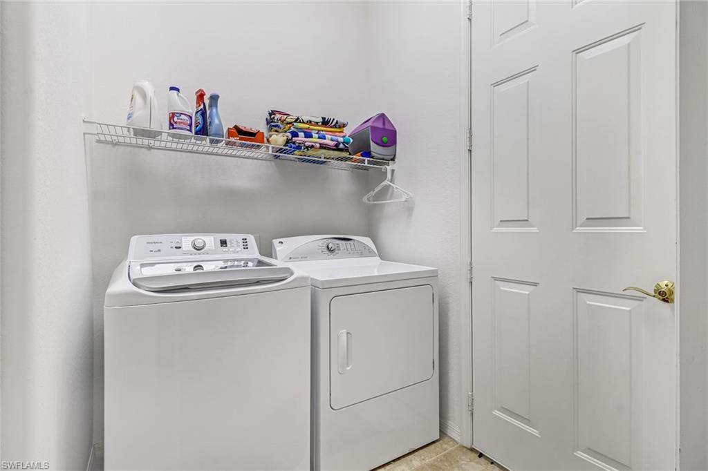 76 Glen Eagle Circle Naples, FL 34104 - Photo 22 of 23 a utility room with dryer and washer