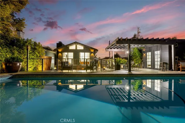 a view of a street with a bench in front of house