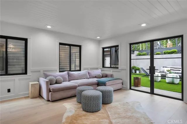 a spacious bedroom with a bed and a large window