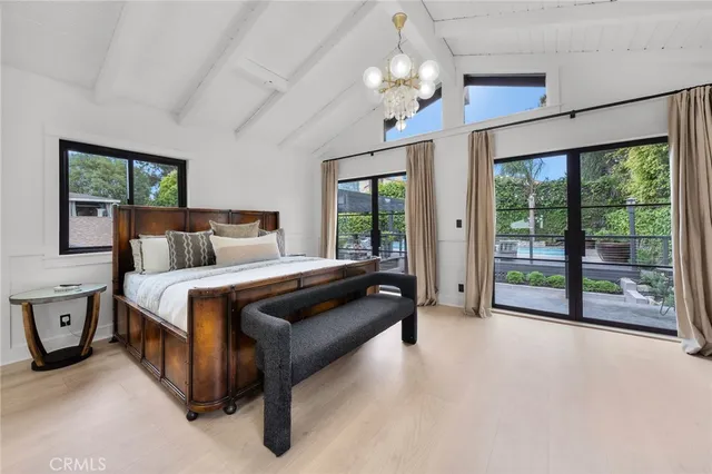 a spacious bathroom with a granite countertop sink mirror and shower
