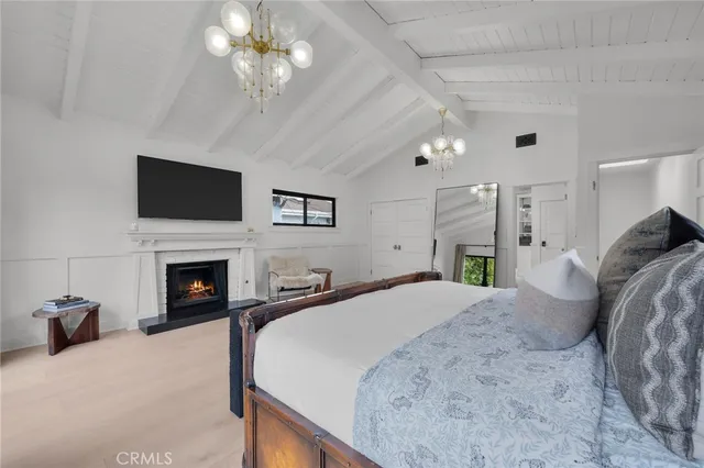 a view of a house with a yard and furniture