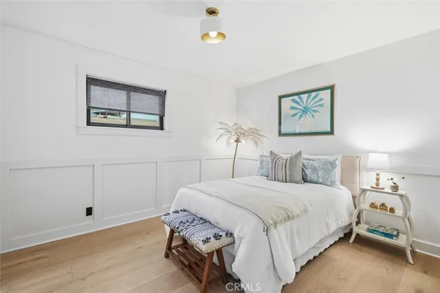 a view of a house with a yard and potted plants