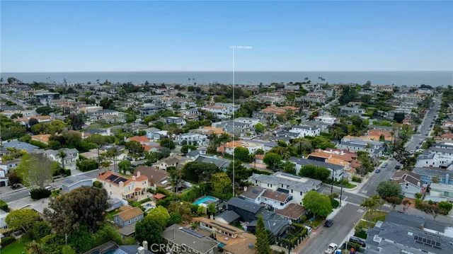 an aerial view of multiple houses with yard
