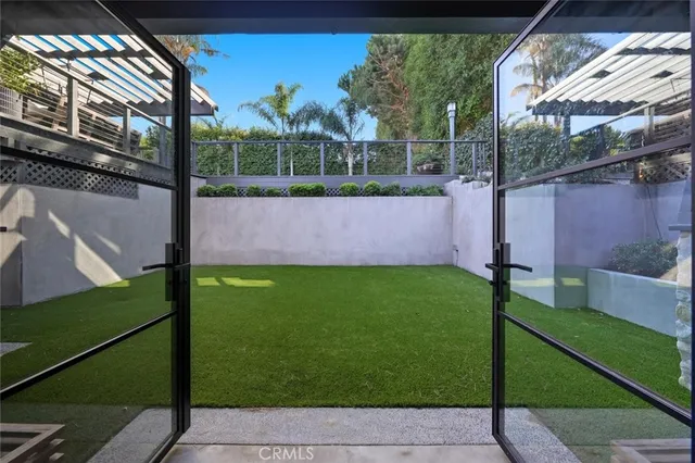 a view of a swimming pool and trees in the background