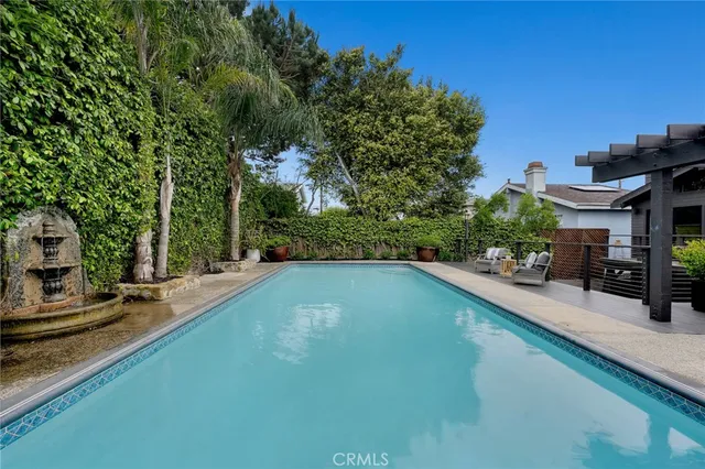 an aerial view of multiple houses with yard