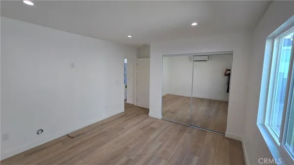 a view of hallway with wooden floor