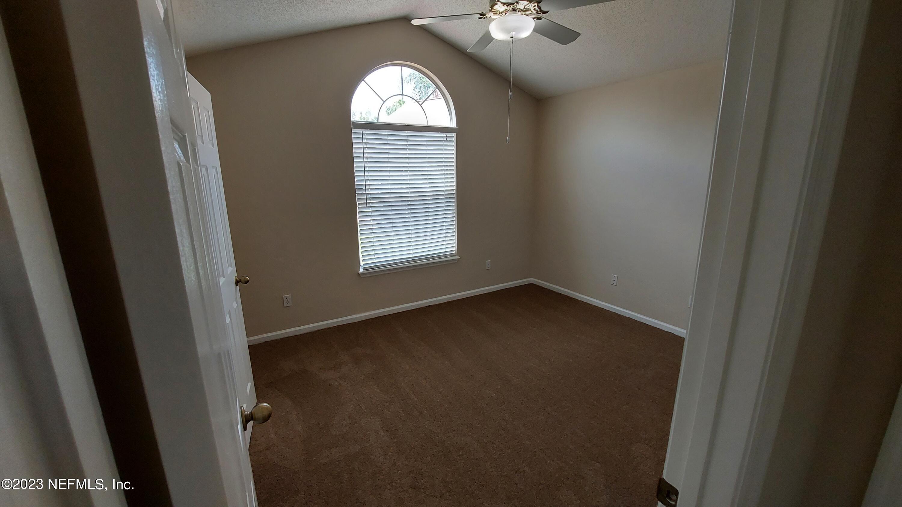 1763 Pickwick Place Orange Park, FL 32003 - Photo 13 of 24 a view of empty room with windows