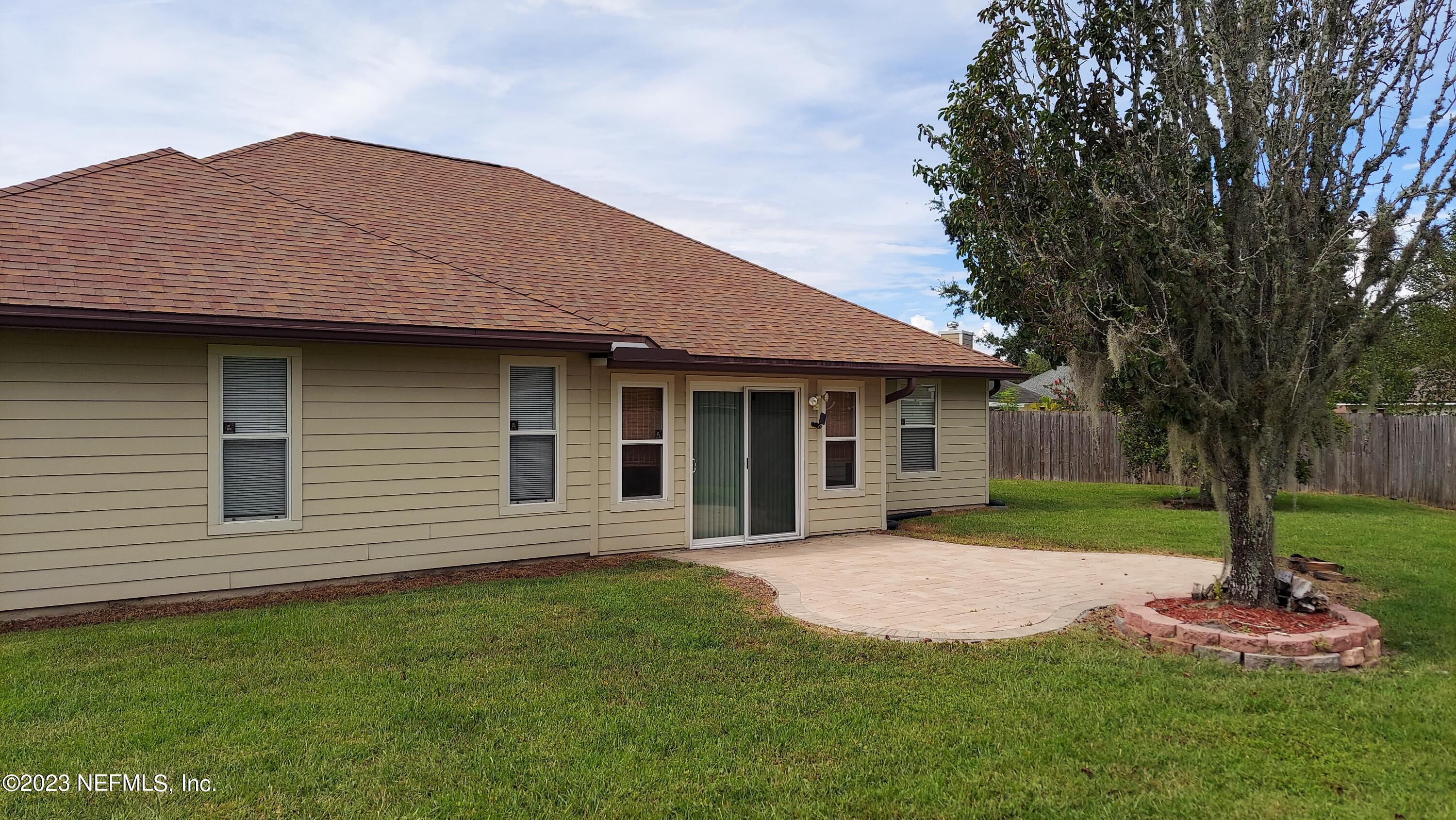 1763 Pickwick Place Orange Park, FL 32003 - Photo 20 of 24 a front view of a house with a garden