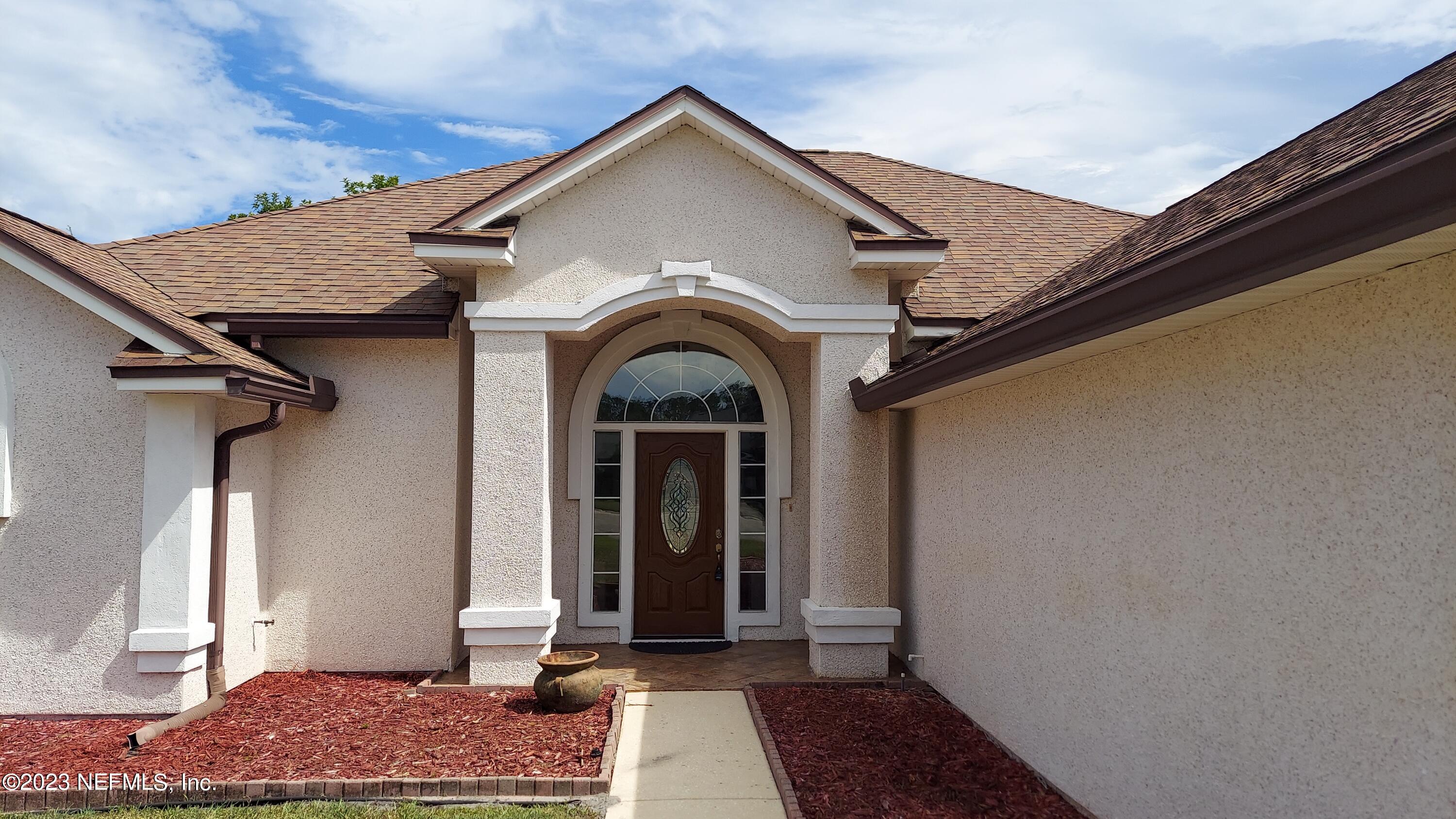 1763 Pickwick Place Orange Park, FL 32003 - Photo 2 of 24 a view of a house with a door and wooden floor