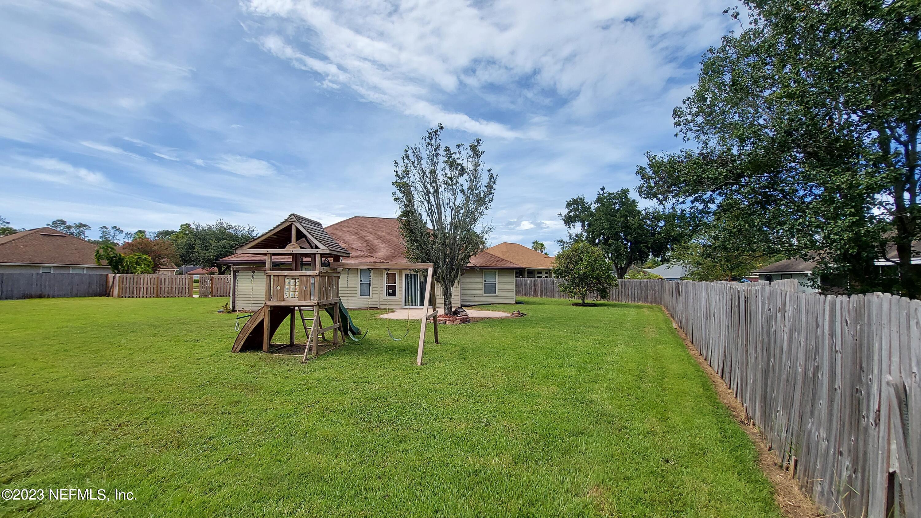 1763 Pickwick Place Orange Park, FL 32003 - Photo 21 of 24 a view of a house with a backyard