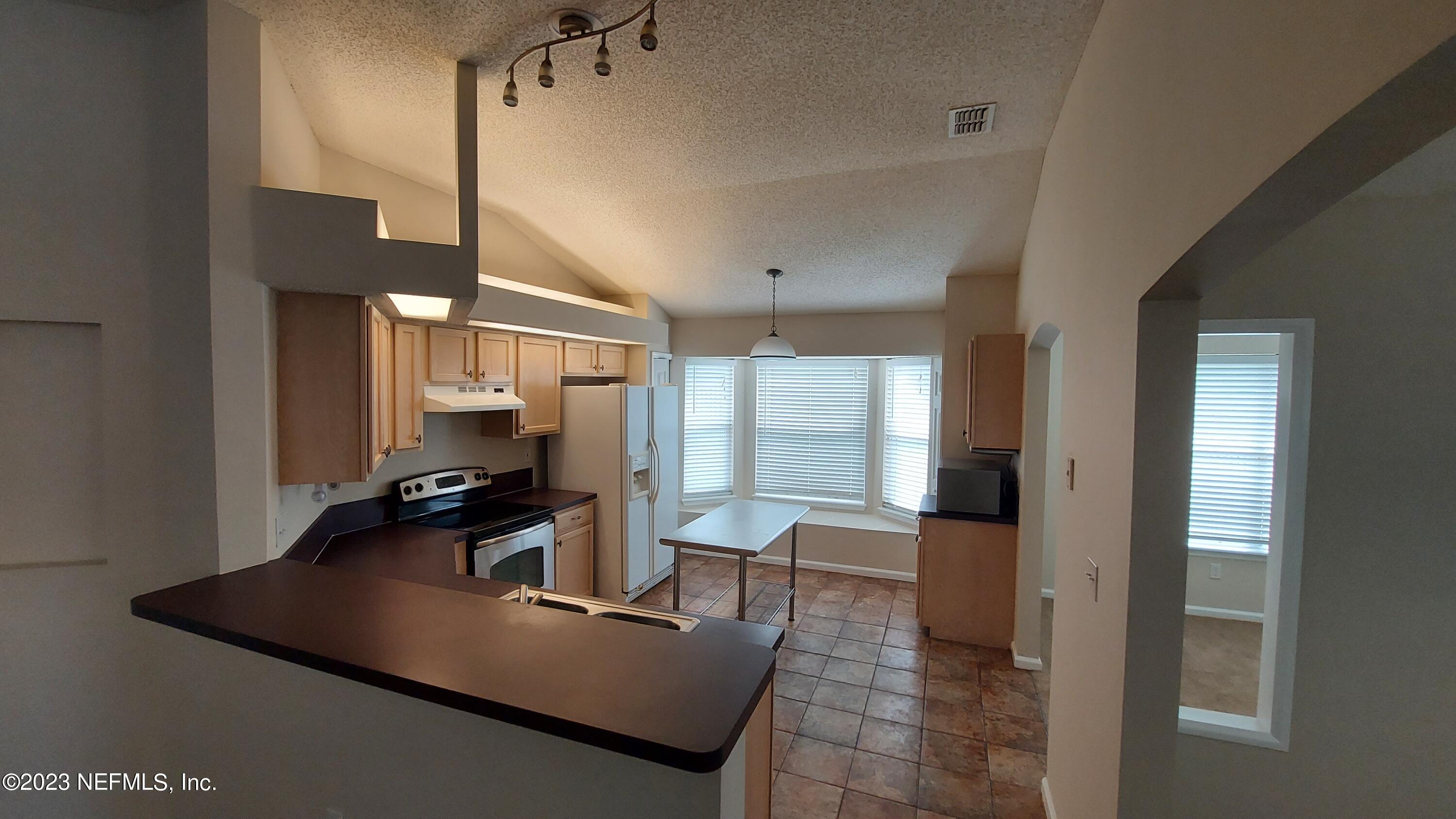 1763 Pickwick Place Orange Park, FL 32003 - Photo 5 of 24 a living room with furniture and a large window